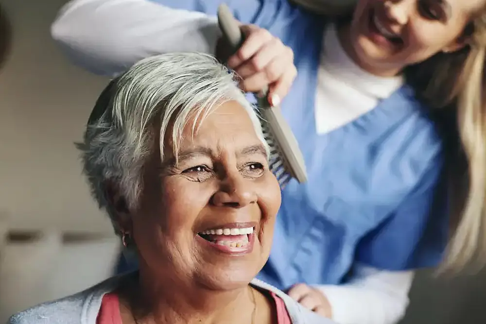 Senior woman cuddling with her dog